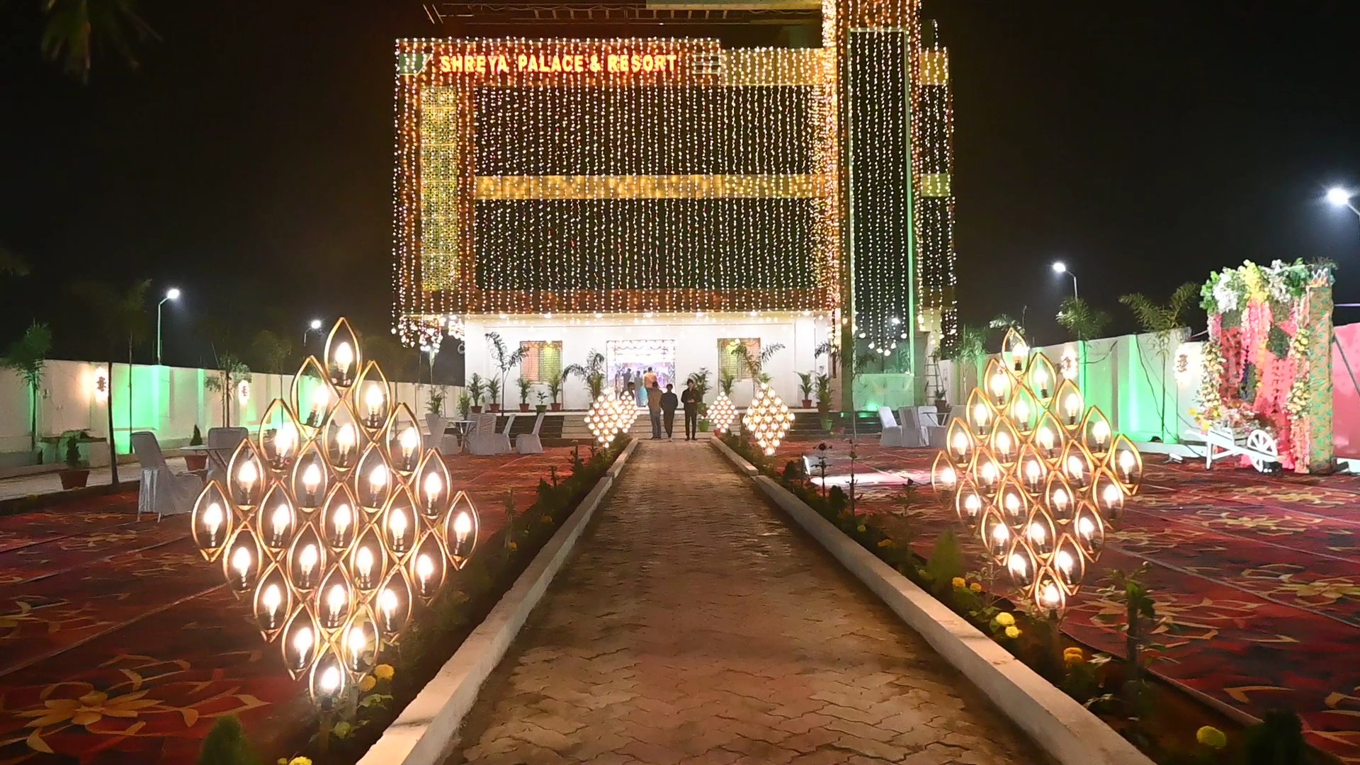 Grand illuminated arrival aisle with glowing candelabras