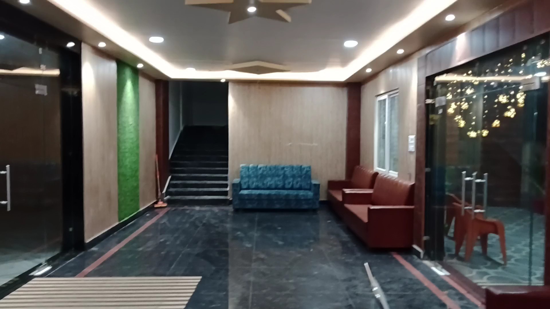 Executive entrance reception lobby with sofas and marble floors
