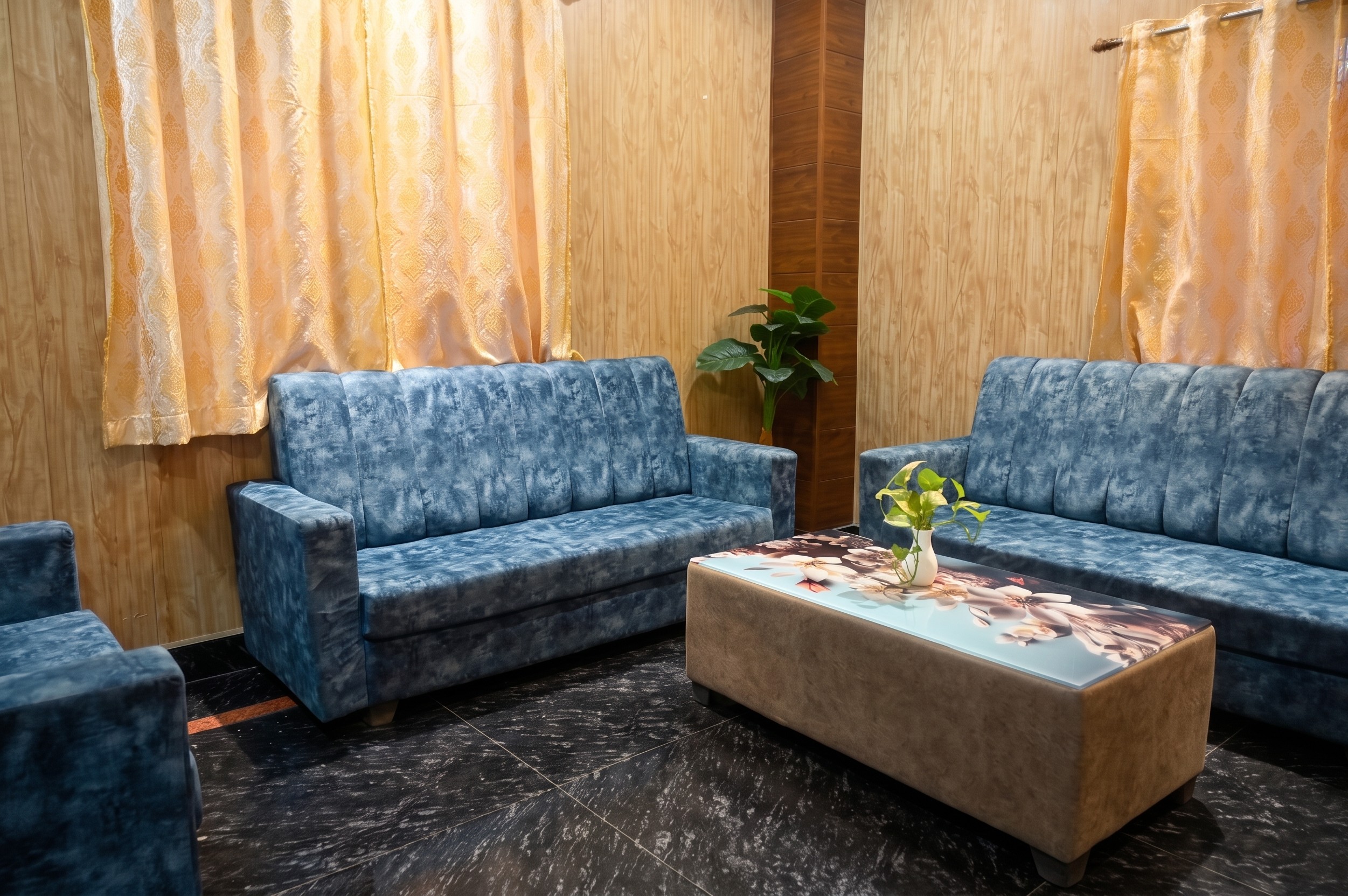 Private bridal suite with velvet sofas and vanity area