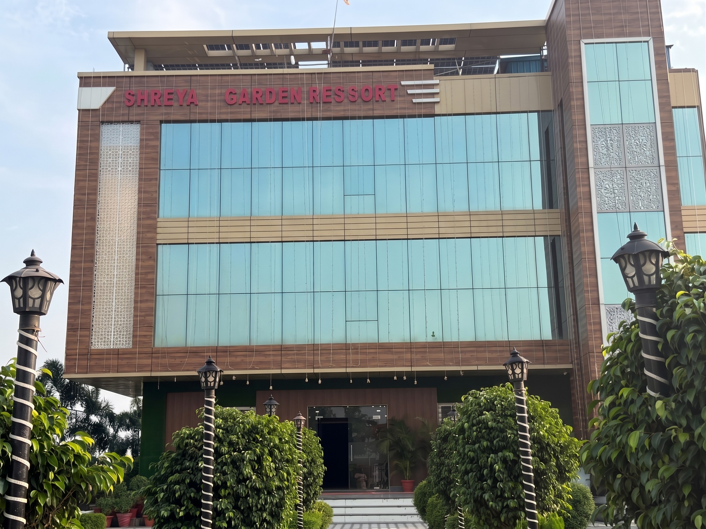 Modern architectural facade and grounds of Shreya Palace & Resort