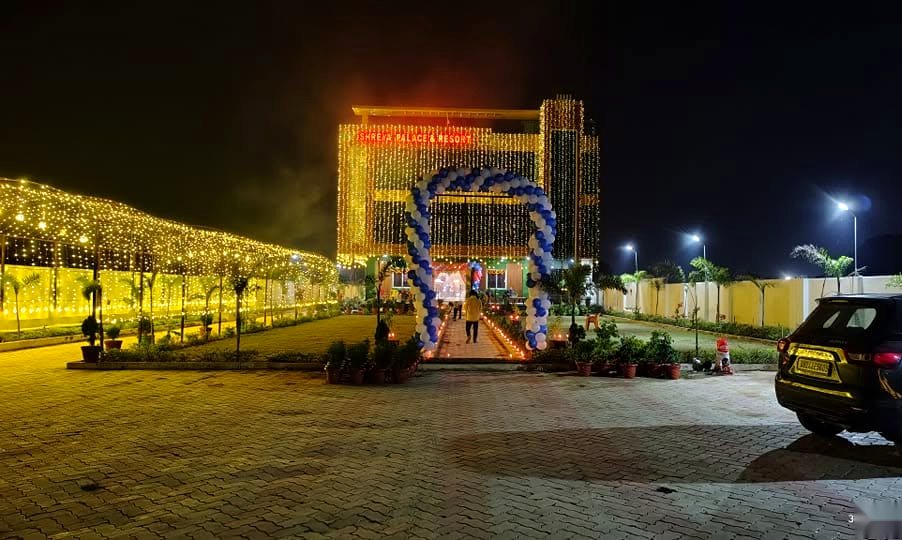 Illuminated night facade at Shreya Palace & Resort
