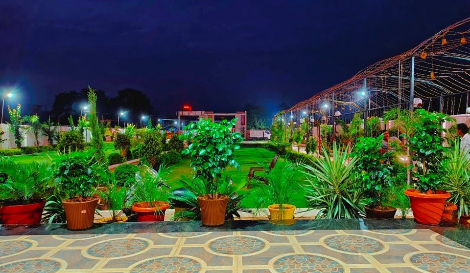 Evening celebration lawn illuminated with fairy lights at Shreya Palace & Resort