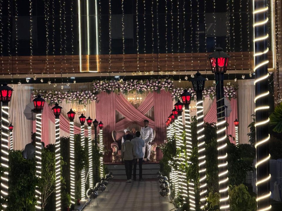 Outdoor stage setup with decorative lantern pillars