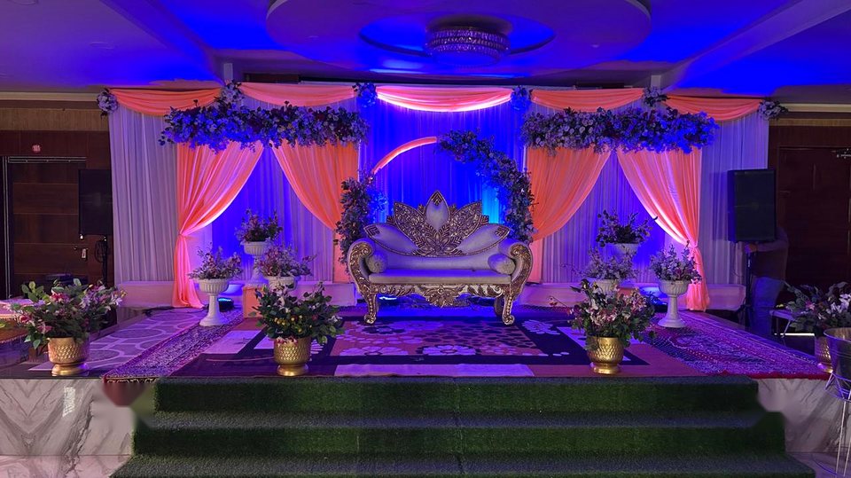 Royal gold wedding stage at Shreya Palace & Resort